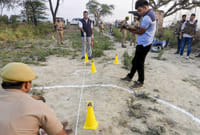 Day In Pics: April 30, 2026 | Photo: PTI : Police and other other officials present at the site as they investigate the triple murder case, in Bulandshahr, Uttar Pradesh.