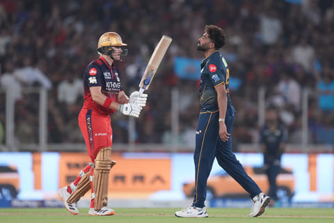 Gujarat Titans' Mohammed Siraj celebrates the wicket of Royal Challengers Bengaluru's Jacob Bethell during the Indian Premier League cricket match between Gujarat Titans and Royal Challengers Bengaluru in Ahmedabad, India.