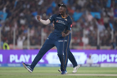 Gujarat Titans' Jason Holder celebrates the wicket of Royal Challengers Bengaluru's Jitesh Sharma during the Indian Premier League cricket match between Gujarat Titans and Royal Challengers Bengaluru in Ahmedabad, India.