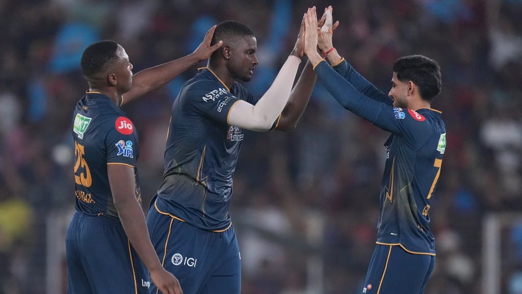 Jason Holder, centre, celebrates the wicket of Romario Shepherd during the Indian Premier League match between Gujarat Titans and Royal Challengers Bengaluru in Ahmedabad. - AP