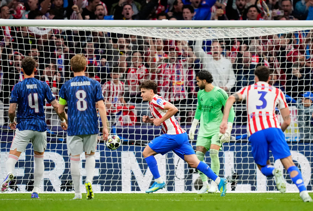 Atletico Madrid's Julian Alvarez celebrates after scoring his side's opening goal during a Champions League semifinal, first leg, soccer match between Atletico Madrid and Arsenal in Madrid, Spain.