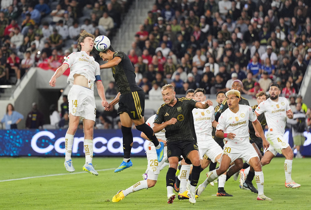 LAFC forward Son Heung-Min (7) and Toluca midfielder Marcel Ruiz (14) jump for a header during the second half of the first leg of a CONCACAF Champions Cup semifinal soccer match in Los Angeles.  - | Photo: AP/Jae C. Hong