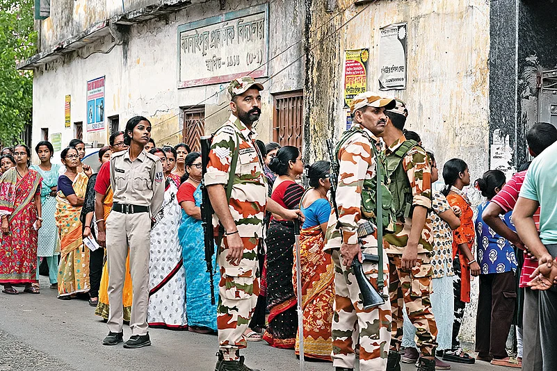 Voters line up to cast their vote in the second phase of the West Bengal election