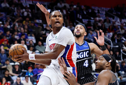 Detroit Pistons guard Ausar Thompson (9) looks to pass the ball against Orlando Magic center Wendell Carter Jr., right, and guard Jalen Suggs (4) during the first half in Game 5 of a first-round NBA basketball playoffs series in Detroit. 