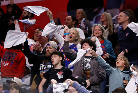 Fans wave rally towels during the second half of a win by the Detroit Pistons over the Orlando Magic in Game 5 of a first-round NBA basketball playoffs series in Detroit. 