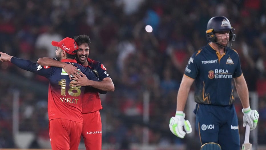 Bhuvneshwar Kumar celebrates the wicket of Jos Buttler during the Indian Premier League match between Gujarat Titans and Royal Challengers Bengaluru in Ahmedabad. - Photo: AP