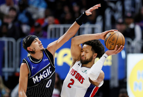 Orlando Magic guard Anthony Black (0) guards Detroit Pistons guard Cade Cunningham (2) during the second half in Game 5 of a first-round NBA basketball playoffs series in Detroit.