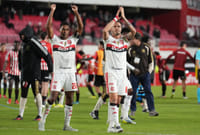 | Photo: AP/Gustavo Garello : Players of Brazil's Flamengo celebrate at the end of a Copa Libertadores Group A soccer match against Argentina's Estudiantes de La Plata, in La Plata, Argentina.