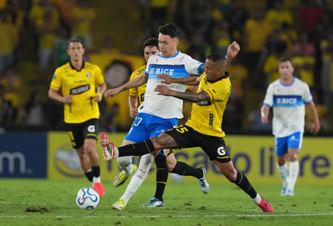 Jefferson Intriago of Ecuador's Barcelona, right, and Alfred Canales of Chile's Universidad Catolica battle for the ball during a Copa Libertadores Group D soccer match in Guayaquil, Ecuador.