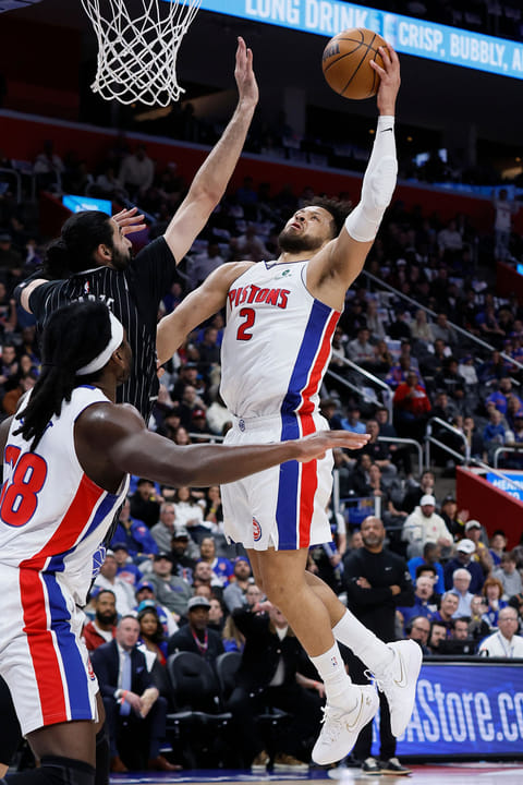 Detroit Pistons guard Cade Cunningham (2) goes to the basket against Orlando Magic center Goga Bitadze, left, during the first half in Game 5 of a first-round NBA basketball playoffs series in Detroit.