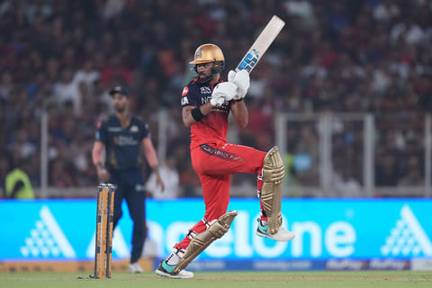 Royal Challengers Bengaluru's Devdutt Padikkal plays a shot during the Indian Premier League cricket match between Gujarat Titans and Royal Challengers Bengaluru in Ahmedabad, India.
