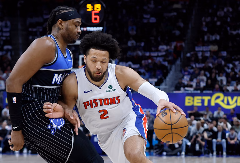 Detroit Pistons guard Cade Cunningham (2) drives against Orlando Magic center Wendell Carter Jr. (34) during the first half in Game 5 of a first-round NBA basketball playoffs series in Detroit. - | Photo: AP/Duane Burleson