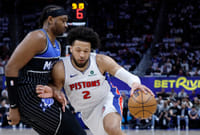 Detroit Pistons 116-109 Orlando Magic, NBA 2026 Playoffs: Cade Cunningham Keeps His Team In The Race | Photo: AP/Duane Burleson : Detroit Pistons guard Cade Cunningham (2) drives against Orlando Magic center Wendell Carter Jr. (34) during the first half in Game 5 of a first-round NBA basketball playoffs series in Detroit.