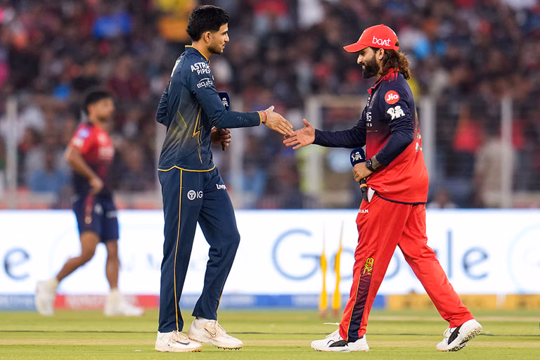Gujarat Titans’ captain Shubman Gill, left, with Royal Challengers Bengaluru’s captain Rajat Patidar during the toss before an Indian Premier League (IPL) 2026 T20 cricket match between Gujarat Titans and Royal Challengers Bengaluru, in Ahmedabad, Gujarat. - | Photo: PTI/Arun Sharma