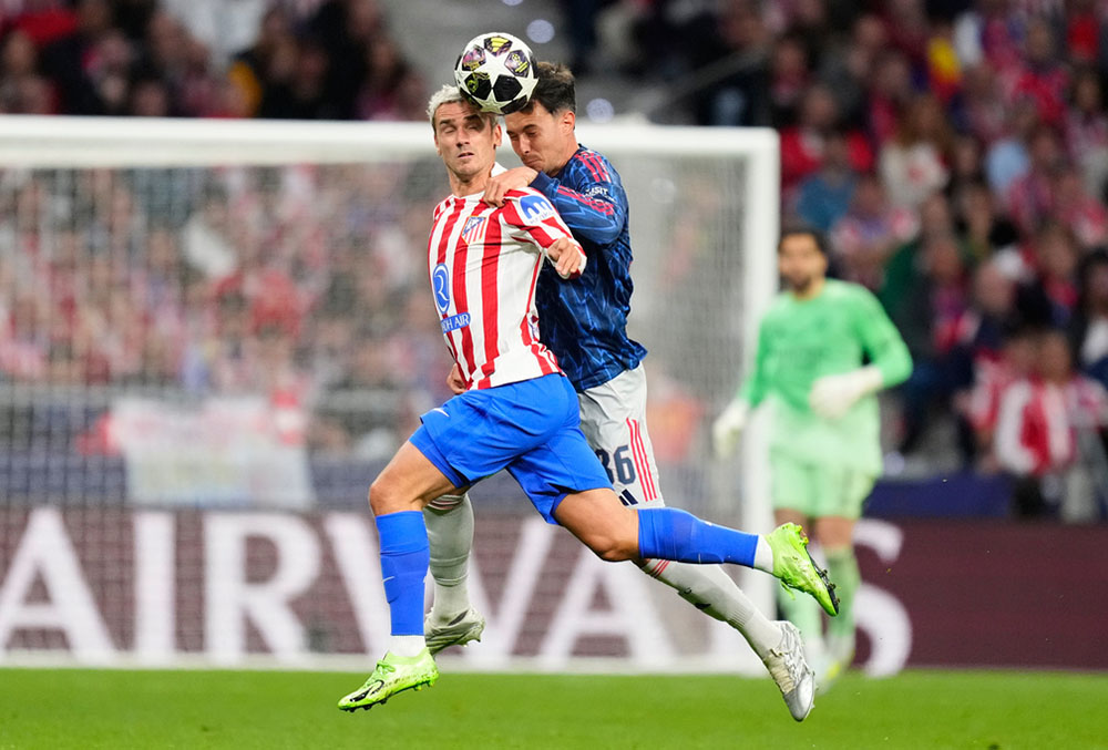 Atletico Madrid's Antoine Griezmann, left, and Arsenal's Martin Zubimendi battle for the ball during a Champions League semifinal, first leg, soccer match between Atletico Madrid and Arsenal in Madrid, Spain.