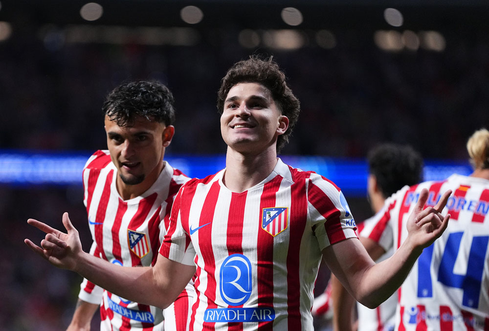 Atletico Madrid's Julian Alvarez, 2nd right, celebrates after scoring his sides first goal during a Champions League semifinal, first leg, soccer match between Atletico Madrid and Arsenal in Madrid, Spain.