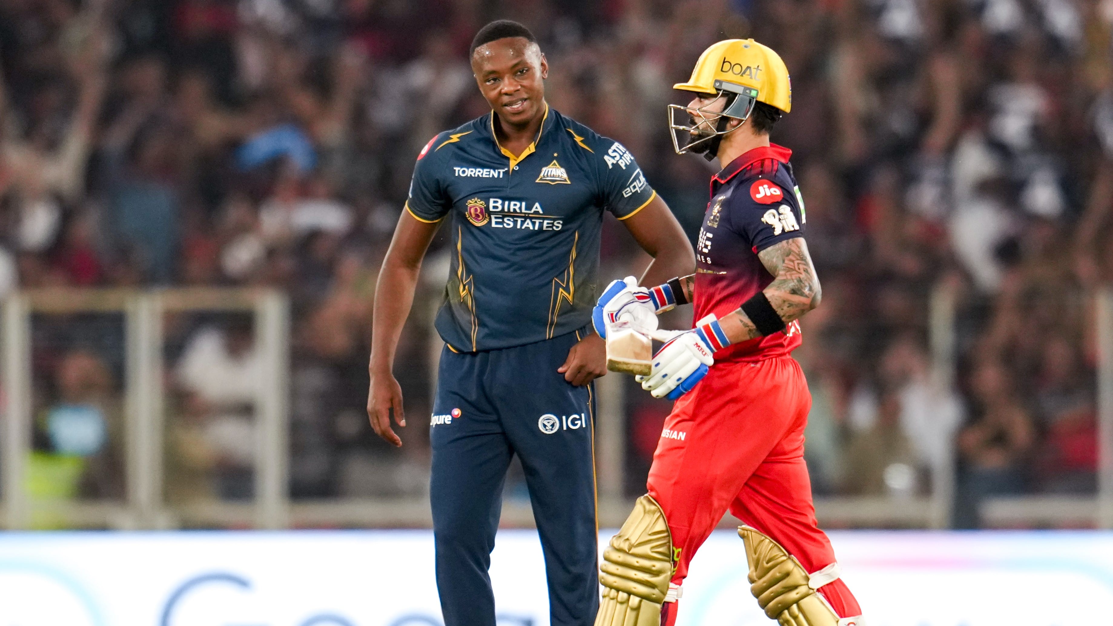 Kagiso Rabada (left) and Virat Kohli in action during the Indian Premier League match between Gujarat Titans and Royal Challengers Bengaluru in Ahmedabad. - PTI
