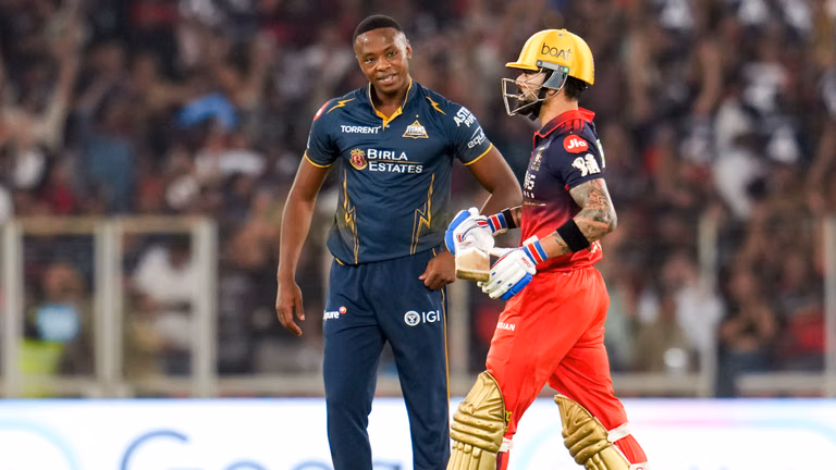 Kagiso Rabada (left) and Virat Kohli in action during the Indian Premier League match between Gujarat Titans and Royal Challengers Bengaluru in Ahmedabad. - PTI