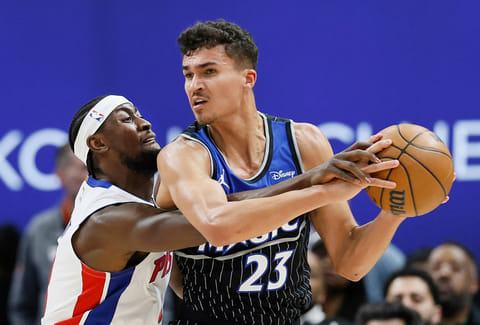 Detroit Pistons guard Caris LeVert, left, reaches in and fouls Orlando Magic forward Tristan da Silva (23) during the first half in Game 5 of a first-round NBA basketball playoffs series in Detroit. 