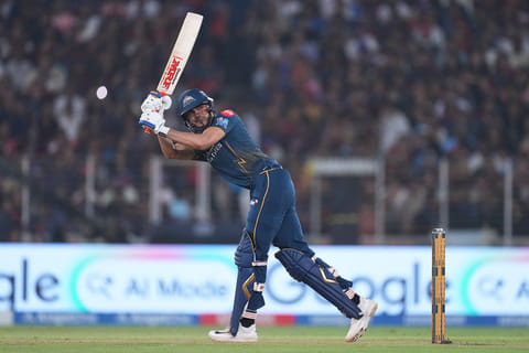 Gujarat Titans' captain Shubman Gill hits a six during the Indian Premier League cricket match between Gujarat Titans and Royal Challengers Bengaluru in Ahmedabad, India.