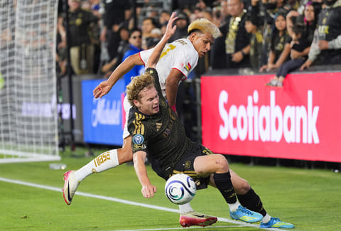 LAFC forward Jacob Shaffelburg (18) collides with Toluca defender Jesus Gallardo (20) during the second half of the first leg of a CONCACAF Champions Cup semifinal soccer match in Los Angeles. 