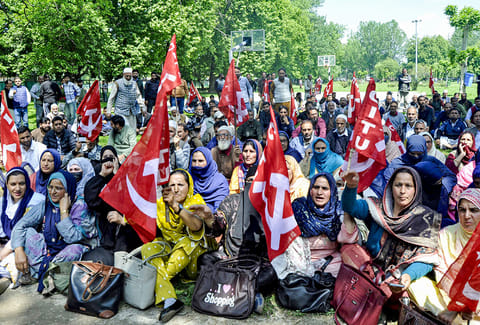 Anganwadi and ASHA workers take part in a sit-in protest organised by Centre of Indian Trade Unions (CITU) over various pending issues on International Labour Day, also known as May Day, in Srinagar, Jammu and Kashmir.