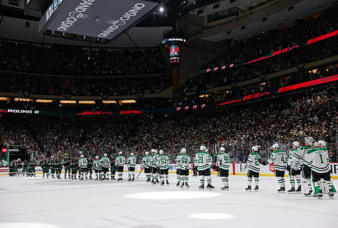 The Minnesota Wild and the Dallas Stars shake hands after Game 6 in the first round of the NHL hockey Stanley Cup playoff series in St. Paul, Minnesota.