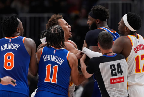 New York Knicks center Mitchell Robinson (23) and Atlanta Hawks guard Dyson Daniels (5) fight in the first half during Game 6 in a first-round NBA basketball playoffs series in Atlanta. 