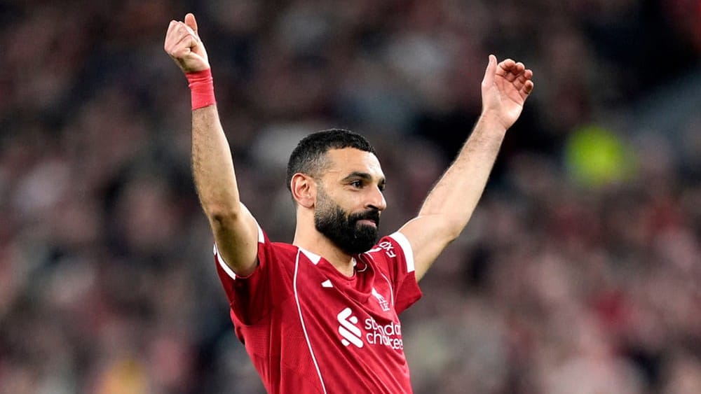 Liverpool's Mohamed Salah celebrates scoring his side's fourth goal  during the second leg of the Champions League round of 16 soccer match between Liverpool and Galatasaray, in Liverpool, England. - | Photo: AP/Jon Super