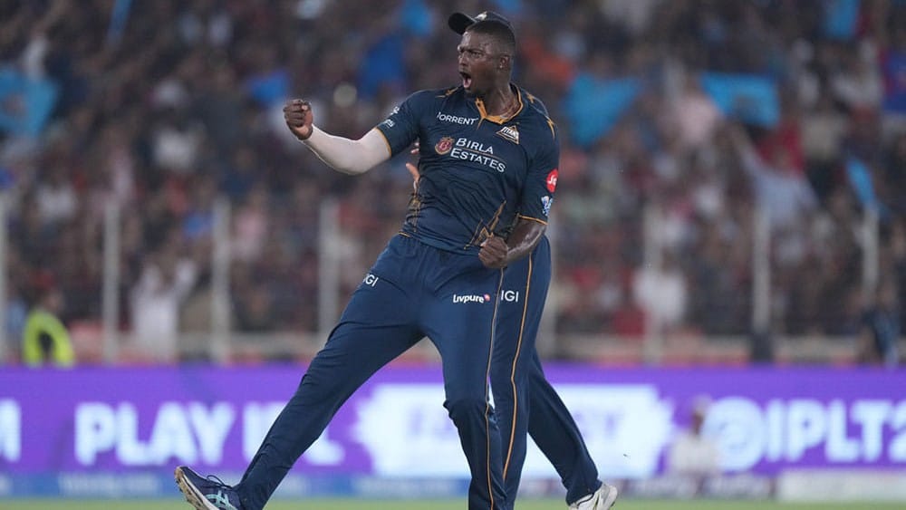 Gujarat Titans' Jason Holder celebrates the wicket of Royal Challengers Bengaluru's Jitesh Sharma during the Indian Premier League cricket match between Gujarat Titans and Royal Challengers Bengaluru in Ahmedabad, India. - | Photo: AP/Ajit Solanki