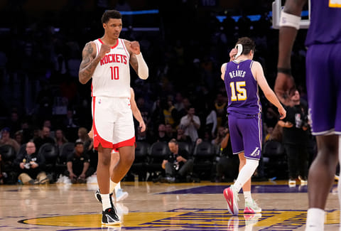 Houston Rockets forward Jabari Smith Jr., left, celebrates as Los Angeles Lakers guard Austin Reaves walks off after the Rockets defeated the Lakers in Game 5 of a first-round NBA playoffs basketball series in Los Angeles.