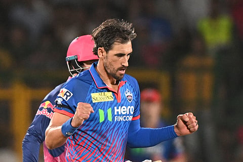 Delhi Capitals' Mitchell Starc celebrates the wicket of Rajasthan Royals' captain Riyan Parag during the Indian Premier League cricket match between Delhi Capitals and Rajasthan Royals in Jaipur, India.