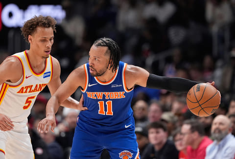 New York Knicks guard Jalen Brunson (11) looks to pass against Atlanta Hawks guard Dyson Daniels (5) in the first half during Game 6 in a first-round NBA basketball playoffs series in Atlanta. 