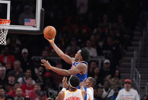 New York Knicks forward Og Anunoby (8) shoots and scores in the first half during Game 6 in a first-round NBA basketball playoffs series against the Atlanta Hawks in Atlanta.  