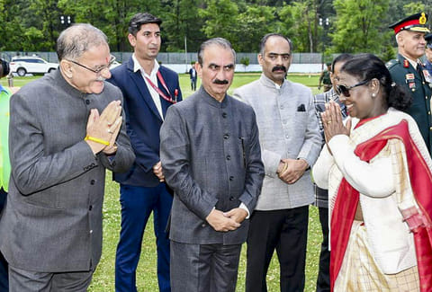 President Droupadi Murmu, right, being greeted by Himachal Pradesh Governor Kavinder Gupta, left, along with state Chief Minister Sukhvinder Singh Sukhu, center, during her visit to Himachal Pradesh, in Shimla.