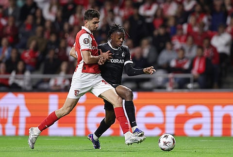 Braga's Demir Ege Tıknaz, left, vies for the ball with Freiburg's Jordy Makengo during the Europa League semifinal, first leg, soccer match between SC Braga and Freiburg in Braga, Portugal.