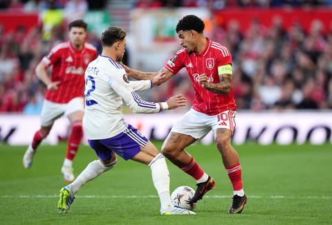 Aston Villa's Matty Cash, left, and Nottingham Forest's Morgan Gibbs-White battle for the ball during the Europa League semifinal first leg soccer match between Nottingham Forest and Aston Villa in Nottingham, England.