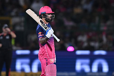 Rajasthan Royals' captain Riyan Parag celebrates his fifty runs during the Indian Premier League cricket match between Delhi Capitals and Rajasthan Royals in Jaipur, India.
