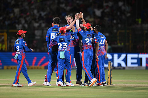 Delhi Capitals' Kyle Jamieson celebrates the wicket of Rajasthan Royals' Vaibhav Sooryavanshi with teammates during the Indian Premier League cricket match between Delhi Capitals and Rajasthan Royals in Jaipur, India.