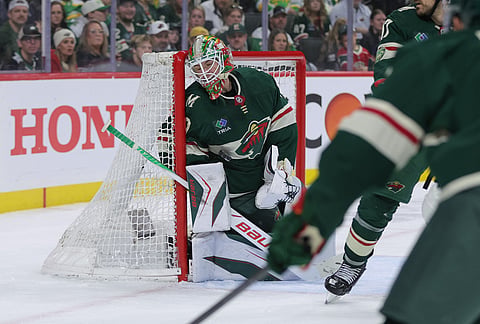 Minnesota Wild goaltender Jesper Wallstedt (30) makes a save during the second period of Game 6 in the first round of the NHL hockey Stanley Cup playoff series against the Dallas Stars, in St. Paul, Minnesota.