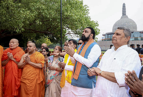 Bihar Chief Minister Samrat Choudhary along with state Deputy CM Vijay Kumar Choudhary, right, and others offer prayers on 'Buddha Purnima', at Buddha Smriti Park, in Patna.