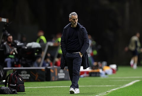 Braga's head coach Carlos Vicens walks by the touchline during the Europa League semifinal, first leg, soccer match between SC Braga and Freiburg in Braga, Portugal.