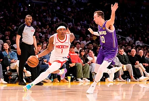 | Photo: AP/Mark J. Terrill : Houston Rockets guard Amen Thompson, left, drives by Los Angeles Lakers guard Luke Kennard during the second half in Game 5 of a first-round NBA playoffs basketball series in Los Angeles.