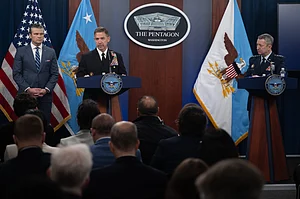 U.S. Secretary of Defense Pete Hegseth, left, U.S. Central Command Commander Adm. Brad Cooper, center, and Chairman of the Joint Chiefs Gen. Dan Caine, right, listen to a question, during a press briefing to discuss the ceasefire and situation with Iran in Operation Epic Fury at the Pentagon