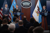 U.S. Secretary of Defense Pete Hegseth, left, U.S. Central Command Commander Adm. Brad Cooper, center, and Chairman of the Joint Chiefs Gen. Dan Caine, right, listen to a question, during a press briefing to discuss the ceasefire and situation with Iran in Operation Epic Fury at the Pentagon
