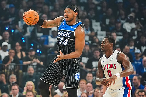 Orlando Magic center Wendell Carter Jr. (34) collects a pass in front of Detroit Pistons center Jalen Duren (0) during the first half in Game 6 of a first-round NBA basketball playoffs series in Orlando, Fla.