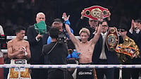 (AP Photo/Hiro Komae) : Naoya Inoue of Japan, right, raises his arms as he beat Junto Nakatani of Japan in a boxing match for the WBA, WBC, IBF and WBO super bantamweight world title in Tokyo, Saturday, May 2, 2026.