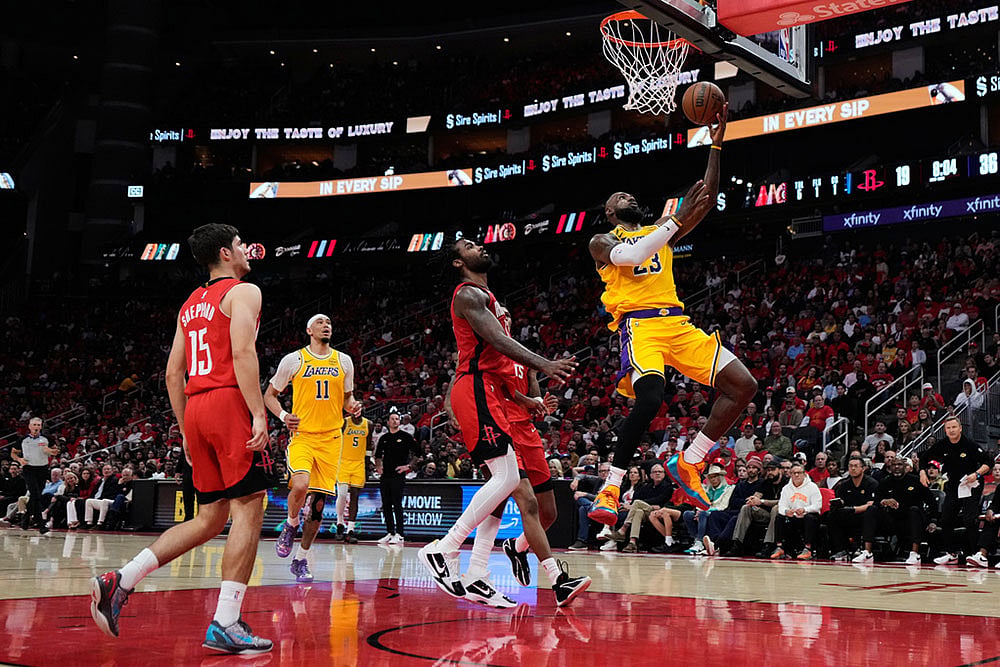 Los Angeles Lakers forward LeBron James (23) shoots during the first half of Game 6 of a first-round NBA playoffs basketball series against the Houston Rockets in Houston. - | Photo: AP/Ashley Landis