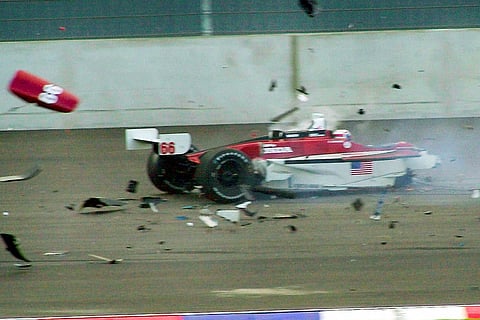 Italian driver Alex Zanardi's car breaks up after it crashed with Canadian driver Alex Tagliani during the CART car race at the Eurospeedway Lausitz in Klettwitz, eastern Germany.