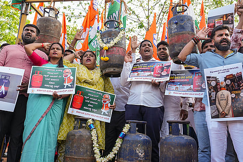 Youth Congress members hold placards and stage a protest over the price hike of LPG gas cylinders, in Bengaluru, Karnataka. A 19-kg commercial LPG cylinder has been hiked by a record Rs 993, marking the third consecutive monthly hike as global energy prices continue to surge. 